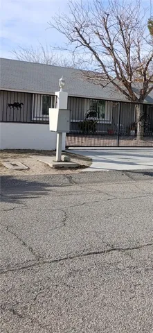 a view of a house with a fence
