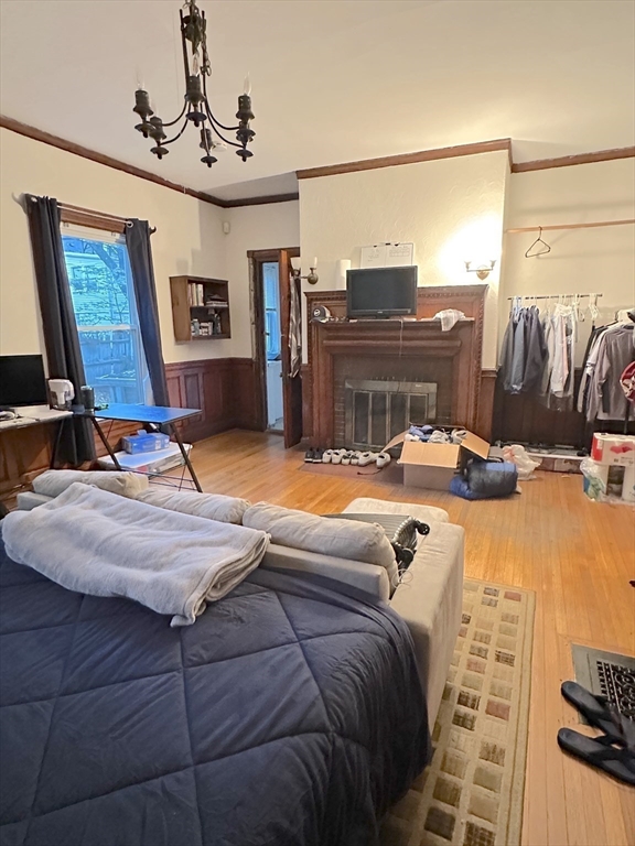27 Orkney Road, Unit 1 Boston, MA 02135 - Photo 15 of 26 a bedroom with a bed and wooden floor