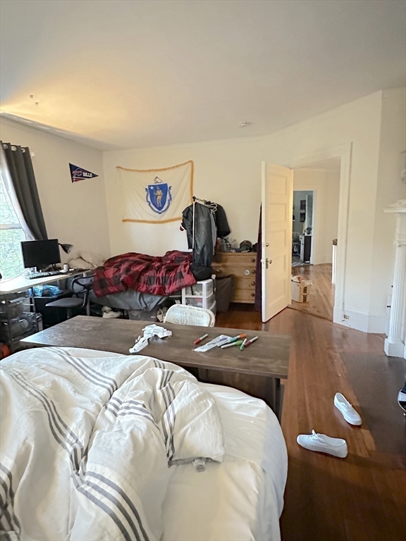 27 Orkney Road, Unit 1 Boston, MA 02135 - Photo 19 of 26 a bedroom with a bed and dresser