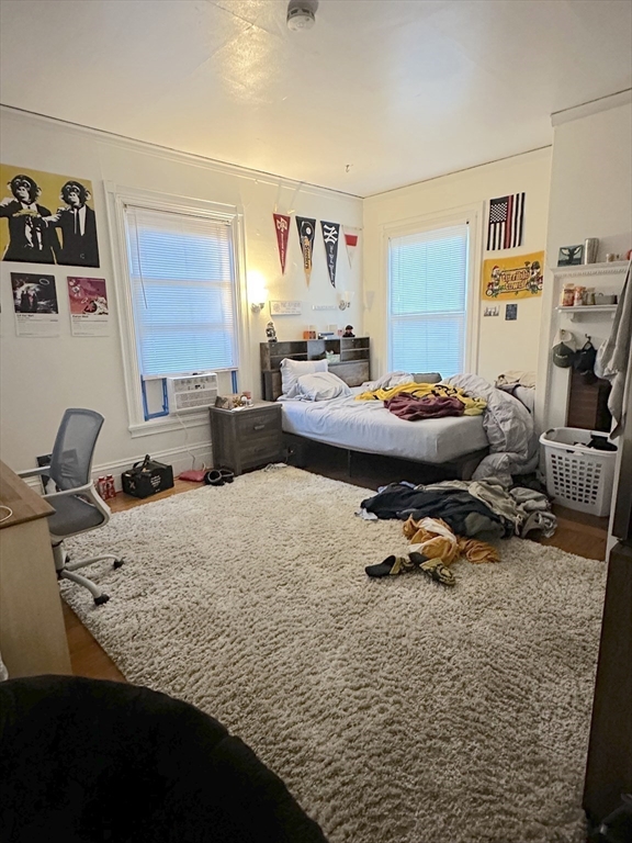 27 Orkney Road, Unit 1 Boston, MA 02135 - Photo 20 of 26 a bedroom with furniture and a bed