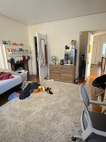 a bedroom with bed and gym equipment