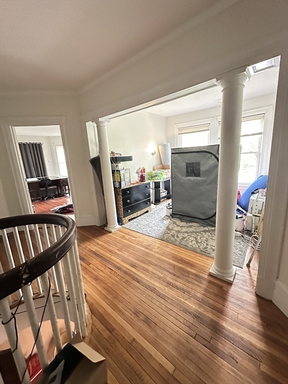 27 Orkney Road, Unit 1 Boston, MA 02135 - Photo 22 of 26 a bedroom with furniture and a wooden floor