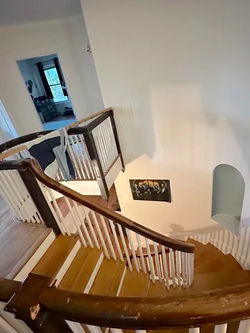 a view of staircase going to a kitchen