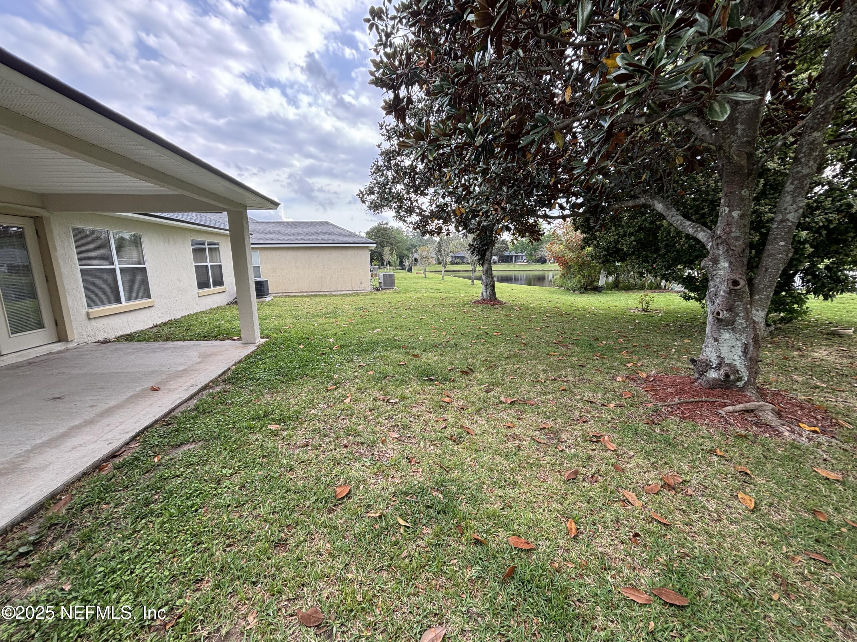 817 Oak Arbor Circle St. Augustine, FL 32084 - Photo 18 of 19 a view of backyard of house with green space