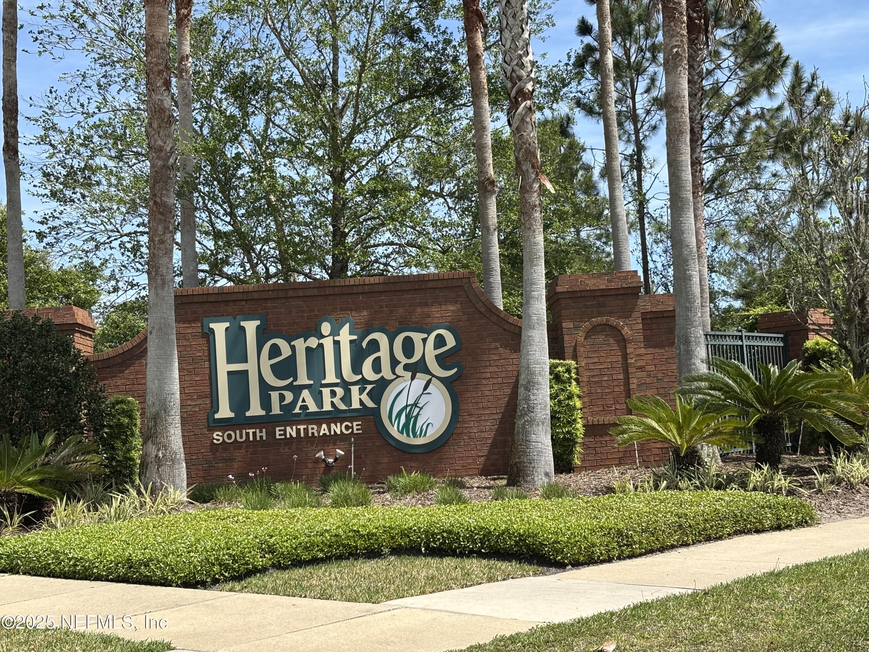 817 Oak Arbor Circle St. Augustine, FL 32084 - Photo 19 of 19 a view of outdoor space with sign board and garden