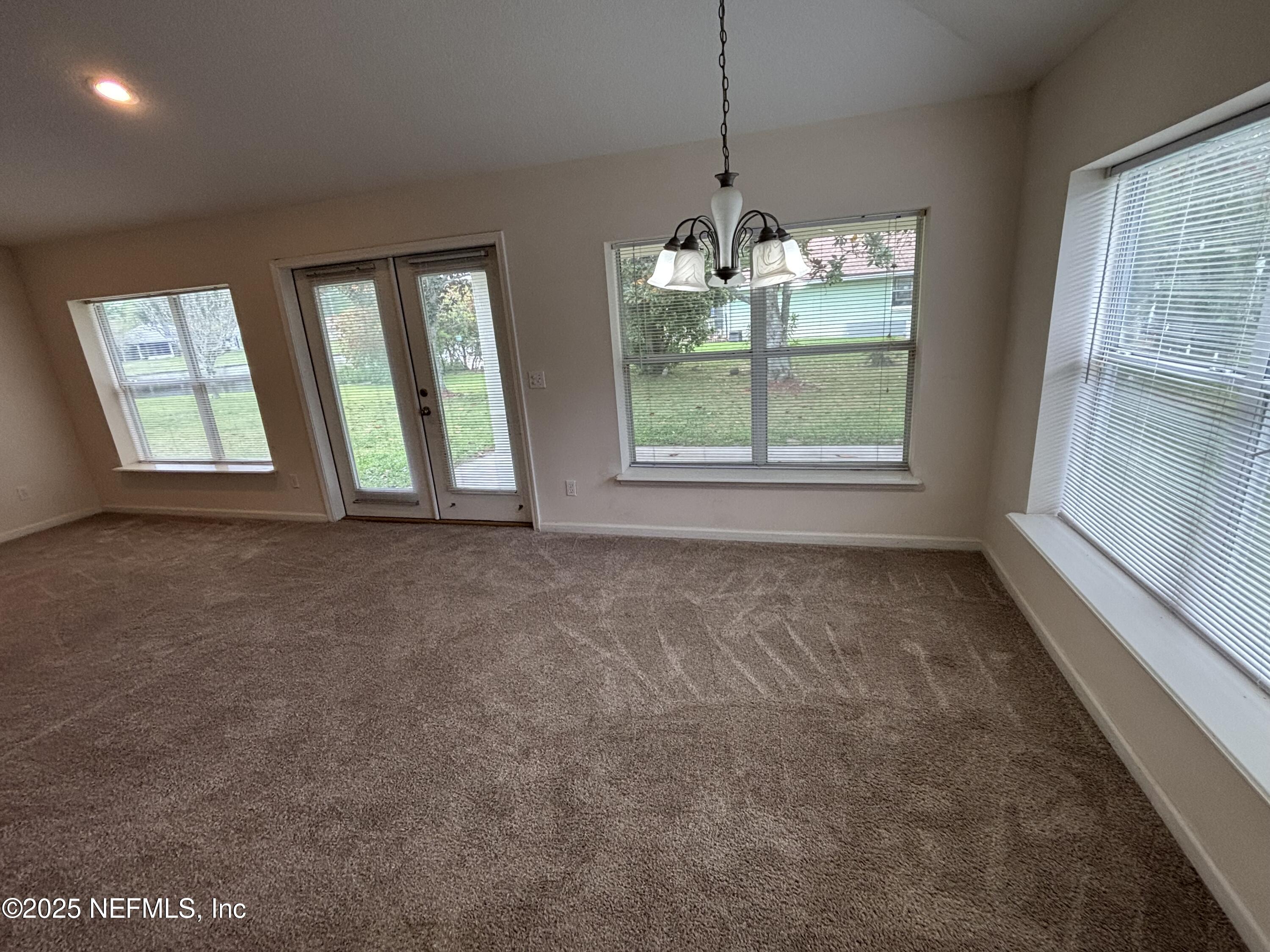 817 Oak Arbor Circle St. Augustine, FL 32084 - Photo 3 of 19 a view of an empty room with windows