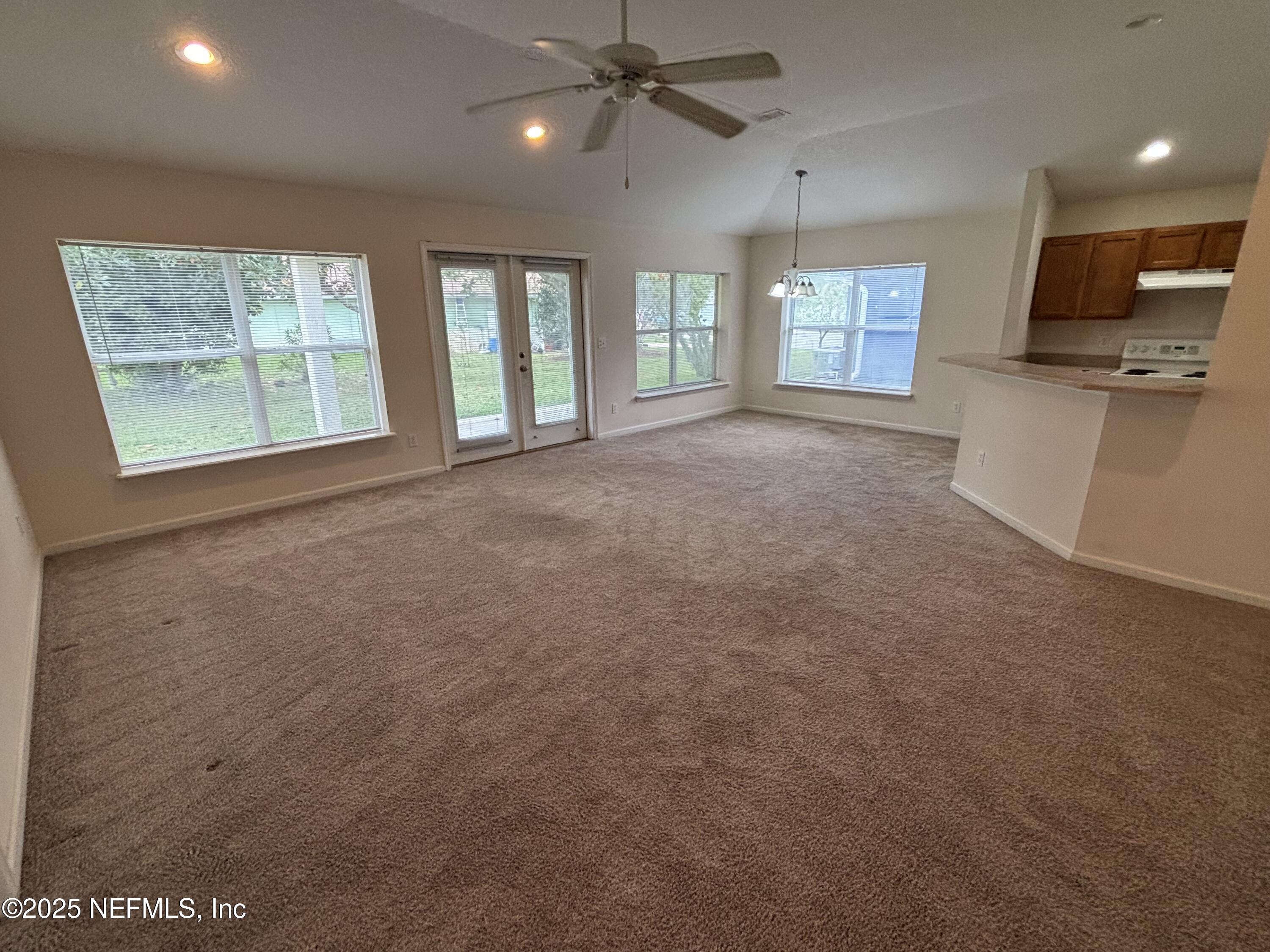 817 Oak Arbor Circle St. Augustine, FL 32084 - Photo 5 of 19 a view of an empty room with a window and fireplace