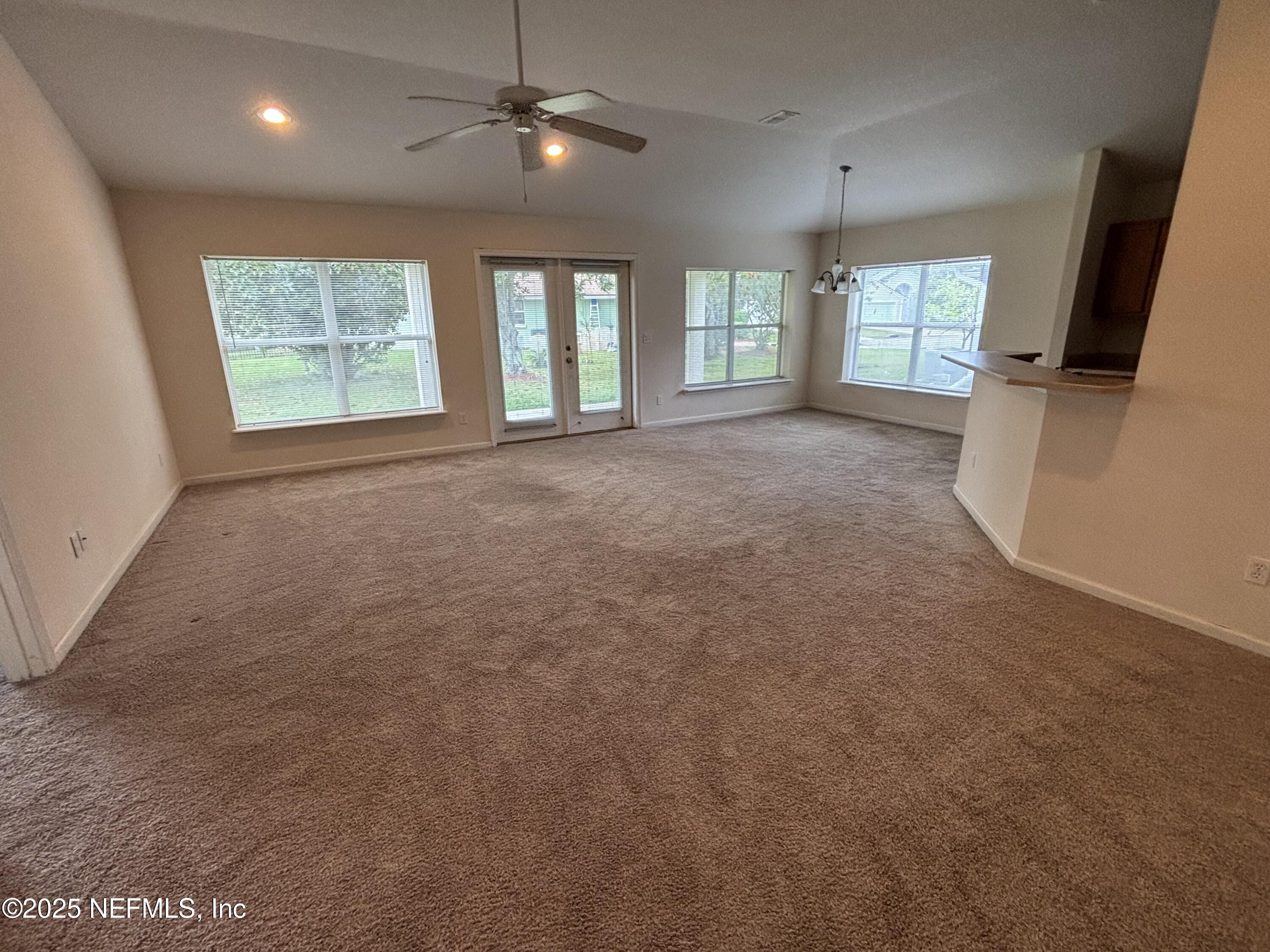 817 Oak Arbor Circle St. Augustine, FL 32084 - Photo 6 of 19 a view of livingroom with natural light hardwood floor and windows