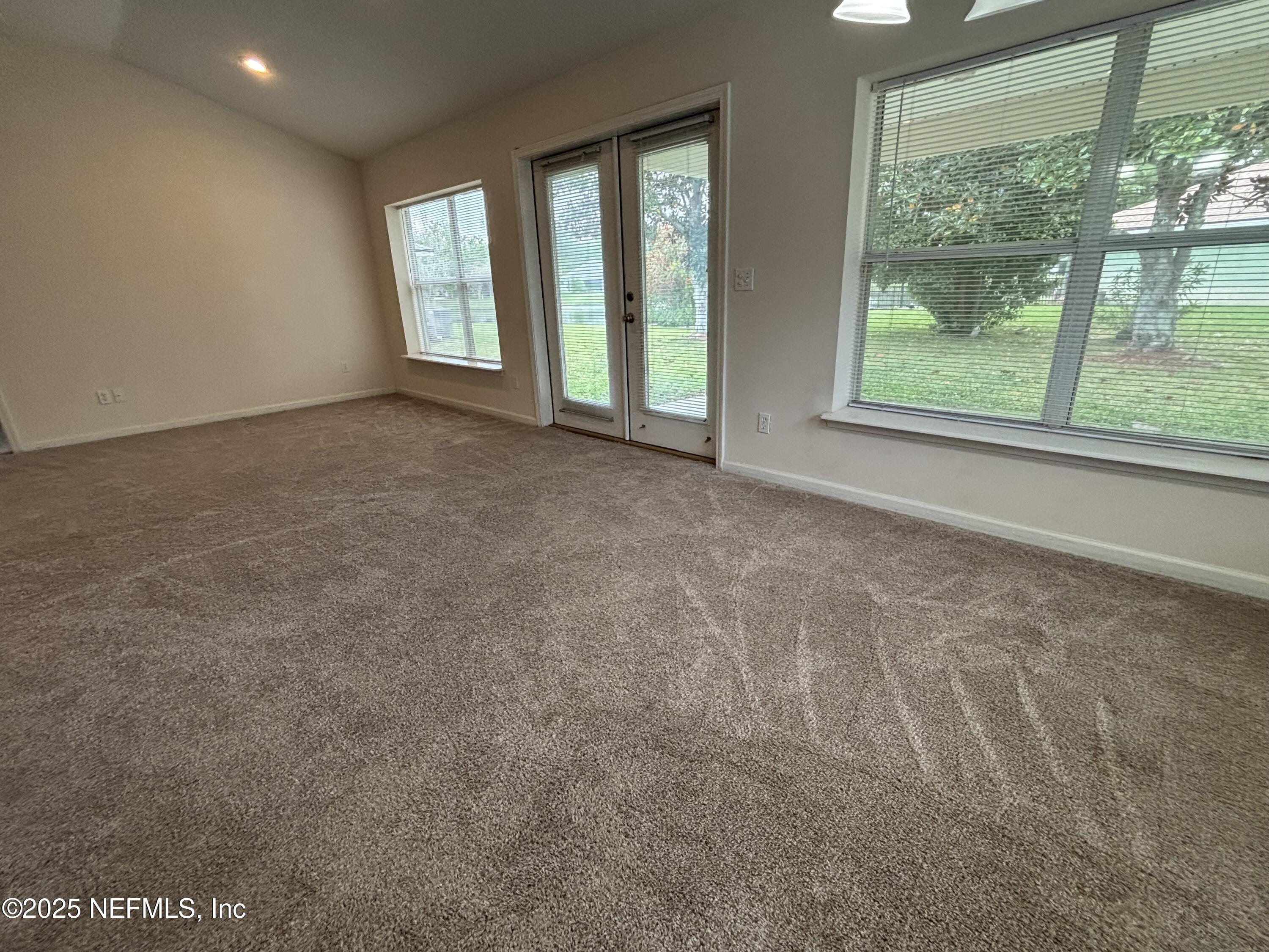 817 Oak Arbor Circle St. Augustine, FL 32084 - Photo 7 of 19 an empty room with windows