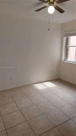 a view of washer and dryer with kitchen in the background