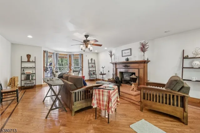 a living room with furniture and a piano