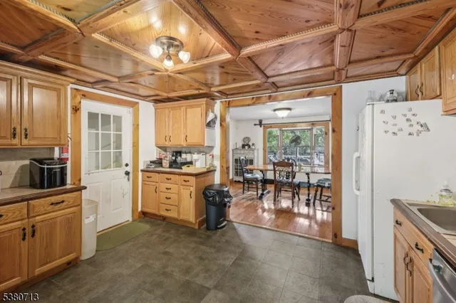 a view of a kitchen with appliances and cabinets