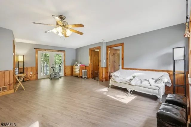 a view of livingroom with furniture and a window