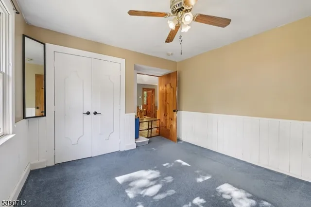 a view of livingroom with hardwood floor and ceiling fan