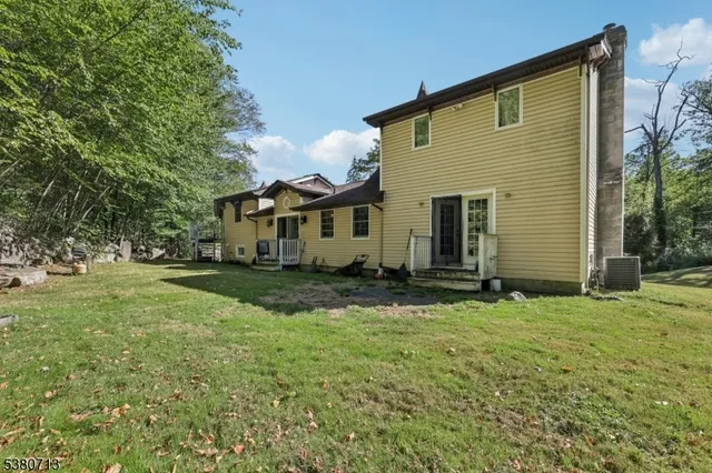 a view of a backyard with sitting area