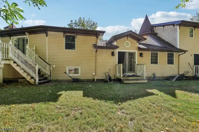 a view of a wooden fence and a pathway