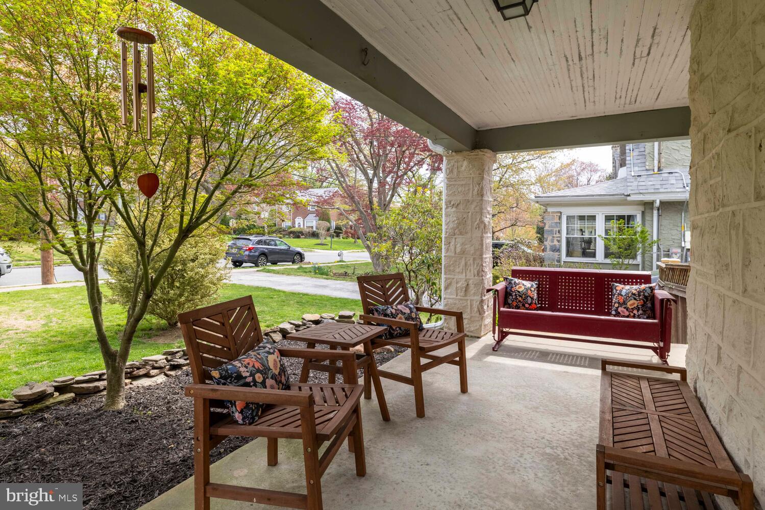 2116 East County Line Road Ardmore, PA 19003 - Photo 3 of 38 a view of a patio with a table chairs and a backyard