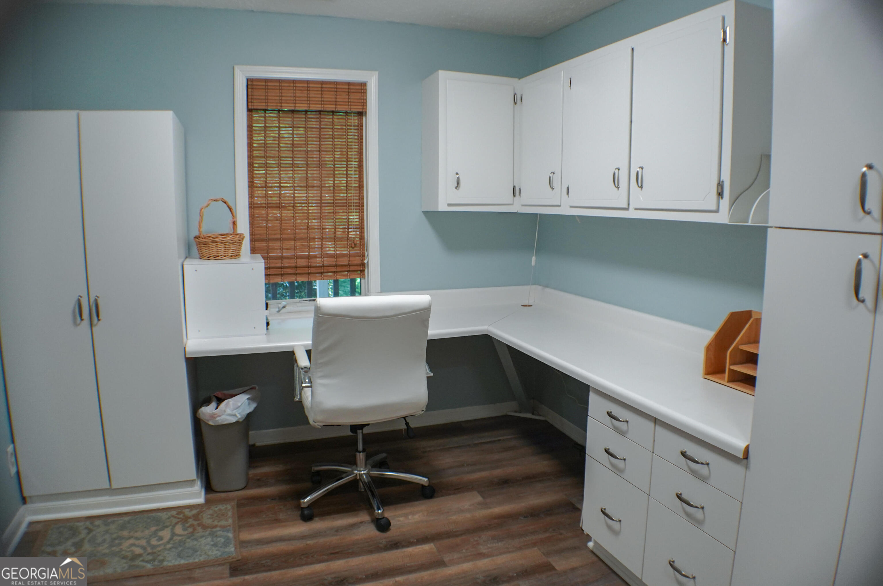 335 Winding Stream Trail Hampton, GA 30228 - Photo 16 of 35 a view of cabinets and chair in a room