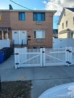a view of a house with a small yard
