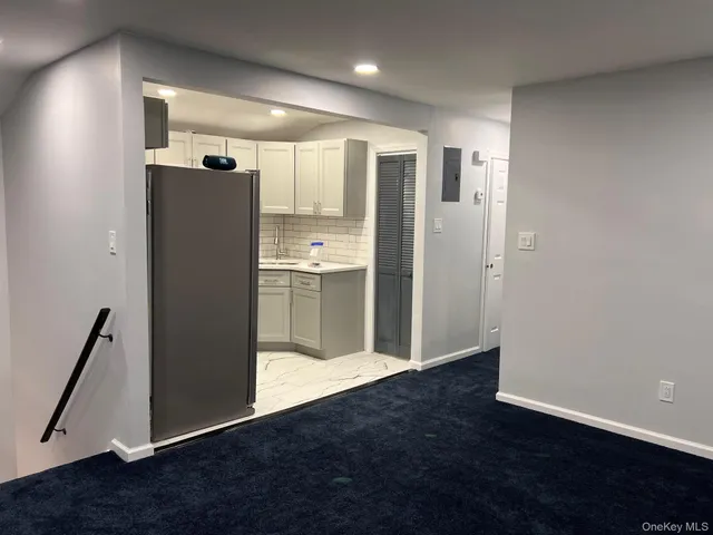 a white toilet sitting next to a bathroom sink