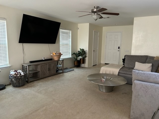 9008 Norwich Castle Austin, TX 78747 - Photo 2 of 26 a living room with furniture and a flat screen tv