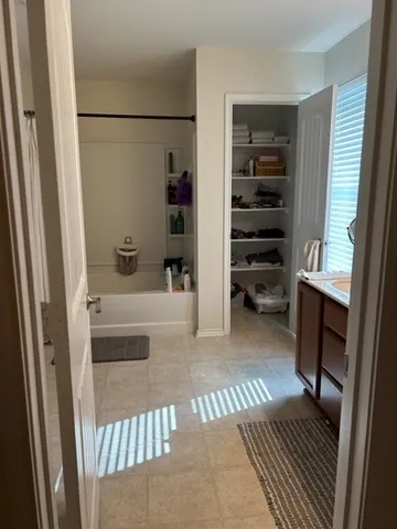 a bathroom with a bathtub and shower