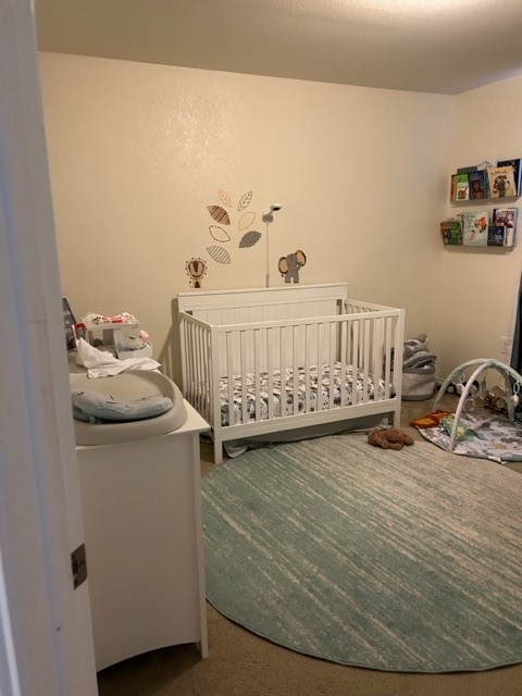 9008 Norwich Castle Austin, TX 78747 - Photo 24 of 26 a bedroom with a bed and wooden floor