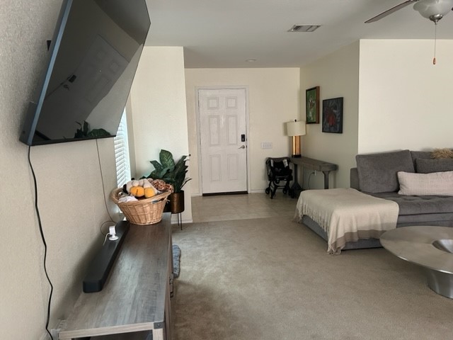 9008 Norwich Castle Austin, TX 78747 - Photo 4 of 26 a living room with furniture and a flat screen tv