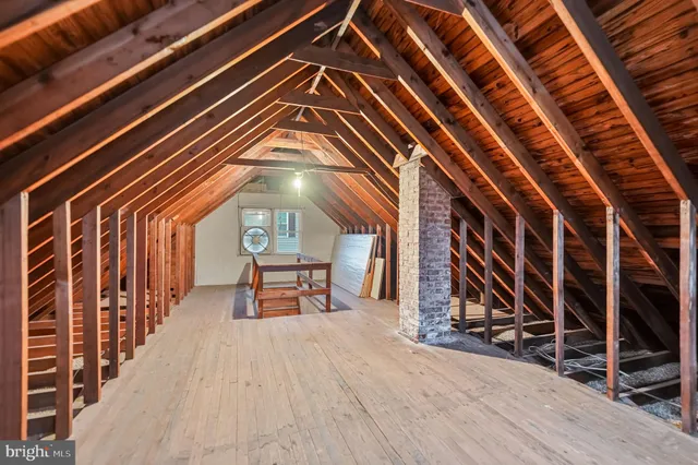 a view of storage and utility room with washer and dryer