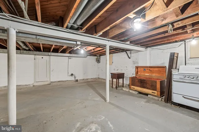 a view of empty room with wooden ceiling