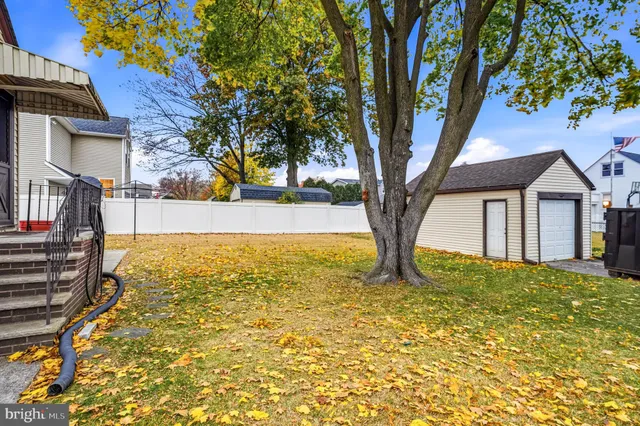 a house that has a tree in front of it