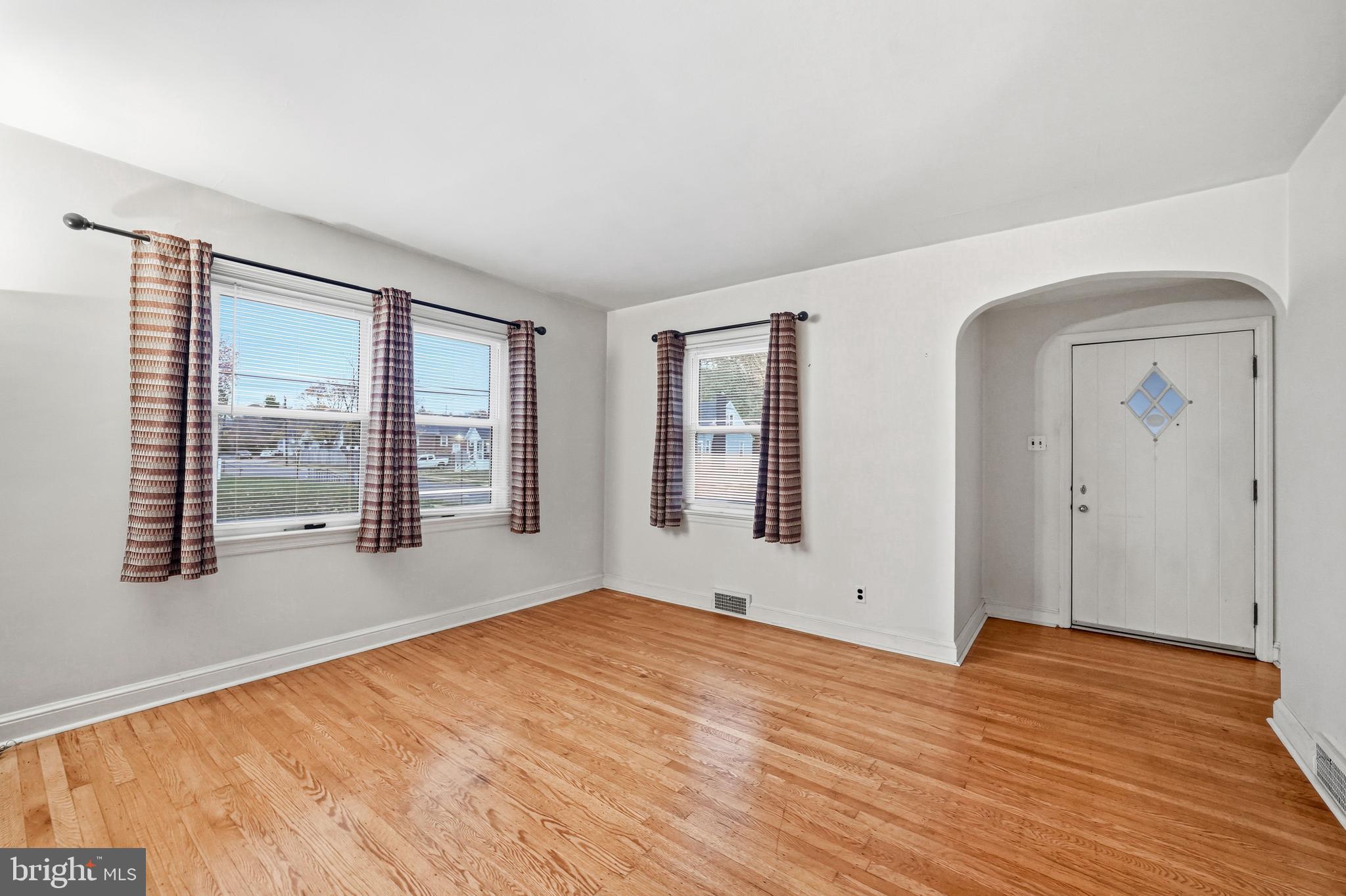 101 6th Avenue Mount Ephraim, NJ 08059 - Photo 6 of 27 a view of empty room with wooden floor and fan