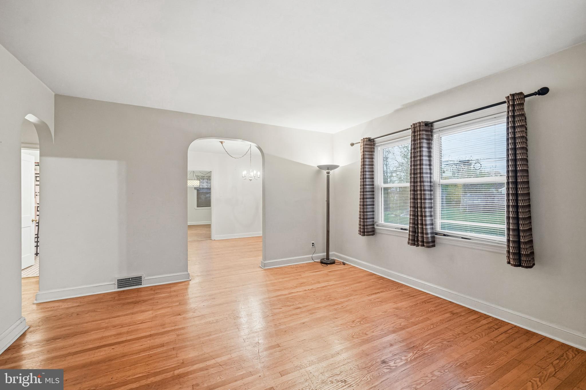 101 6th Avenue Mount Ephraim, NJ 08059 - Photo 7 of 27 a view of an empty room with wooden floor and a window