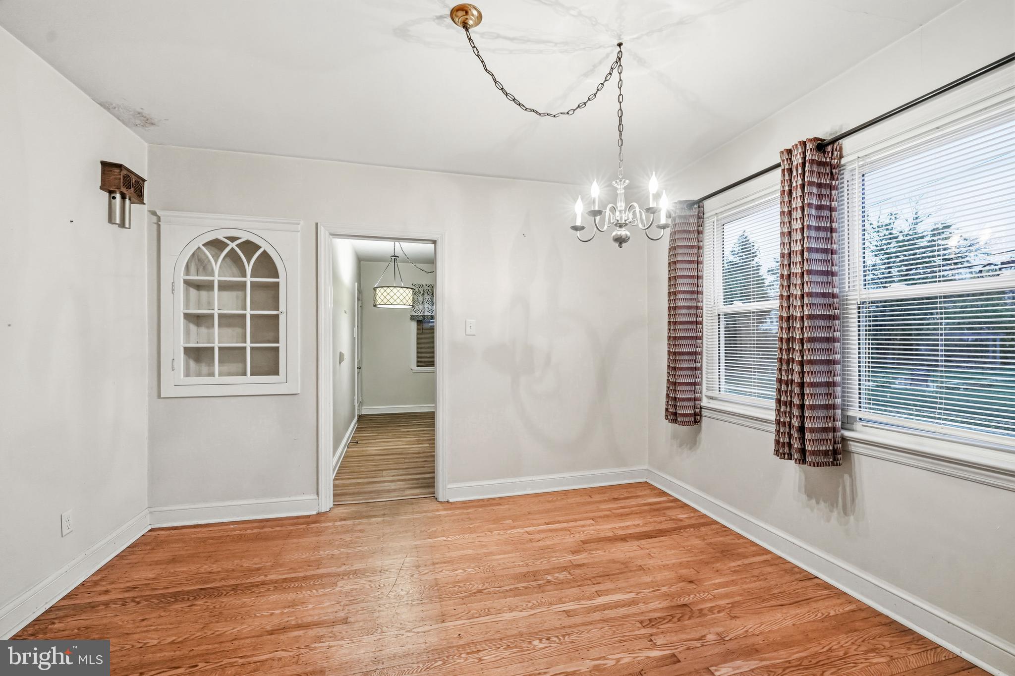101 6th Avenue Mount Ephraim, NJ 08059 - Photo 8 of 27 a view of a livingroom with wooden floor and windows