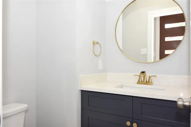a kitchen with stainless steel appliances a sink stove and refrigerator