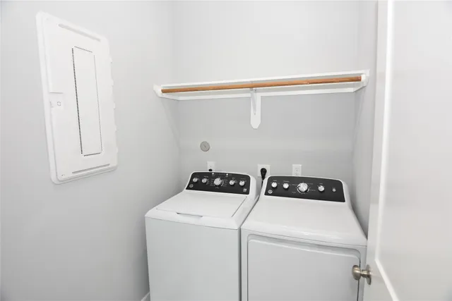 a bathroom with a toilet and bathtub