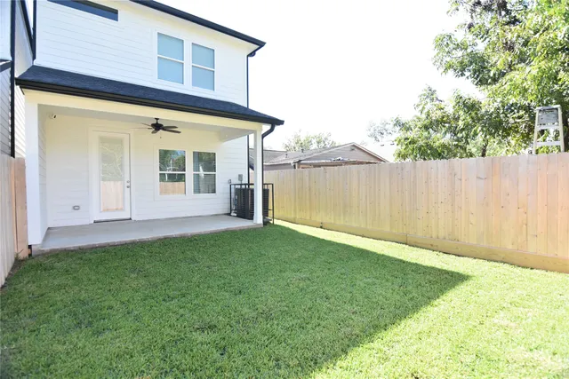 a view of a house with a backyard