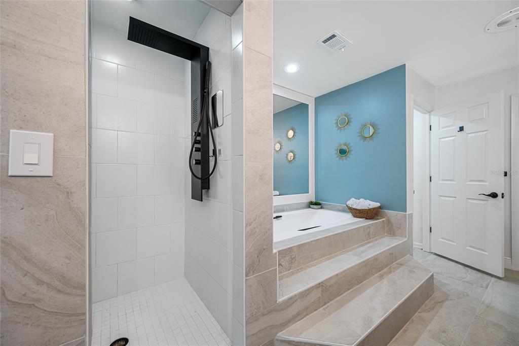 2153 Karan Way Clearwater, FL 33763 - Photo 33 of 65 a bedroom with a bed and a shower