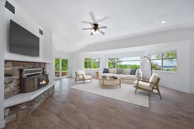 a living room with furniture fireplace and a flat screen tv