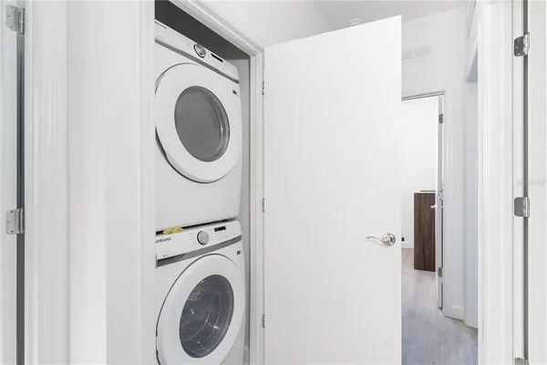 a close view of a utility room with dryer and washer