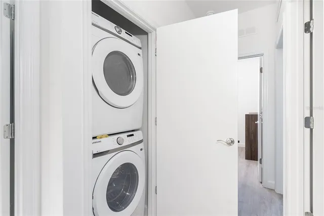 a close view of a utility room with dryer and washer