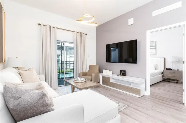 a living room with furniture and a flat screen tv