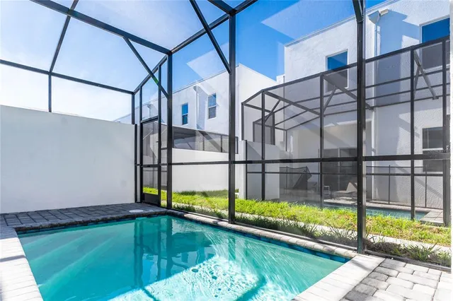 a view of swimming pool with a backyard