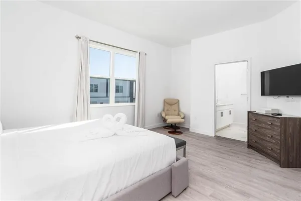 a bedroom with a bed and furniture