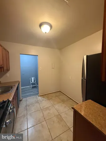 a kitchen with a cabinets and a stove top oven