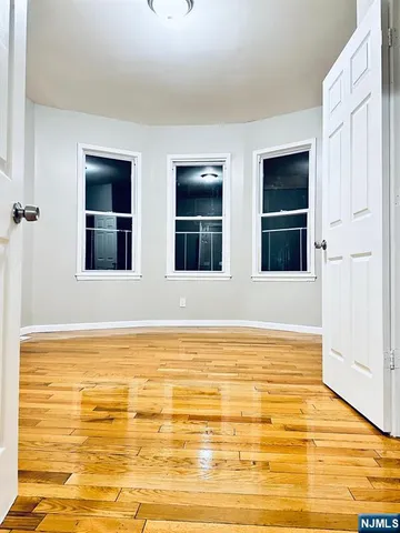 a view of an empty room with closet