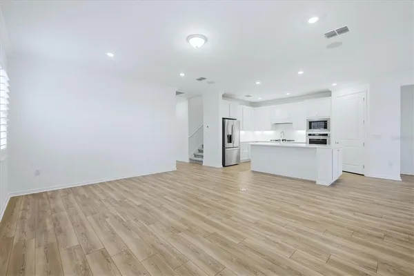 a view of kitchen with wooden floor