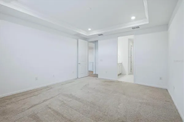 a living room with furniture and a dining table