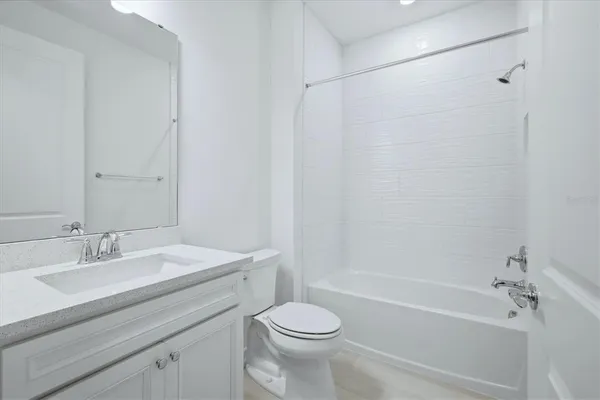 a bathroom with a sink and vanity