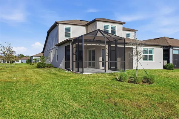 a view of a counter top space with stainless steel appliances wooden floor and view kitchen